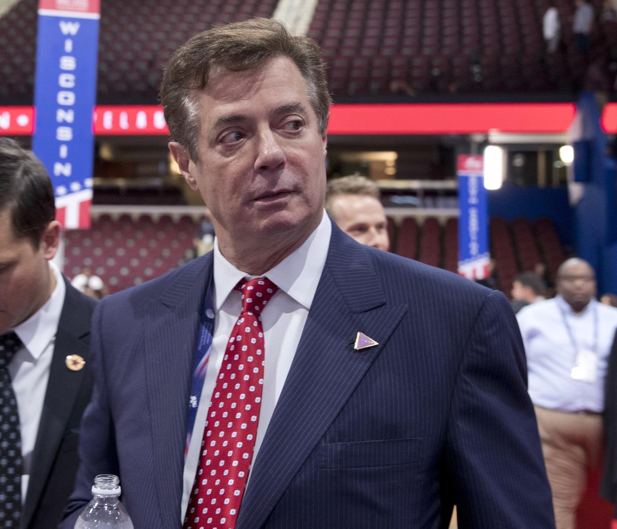 FILE - In this July 18, 2016 file photo, then-Trump campaign chairman Paul Manafort walks around the convention floor before the opening session of the Republican National Convention in Cleveland. (Carolyn Kaster / AP)