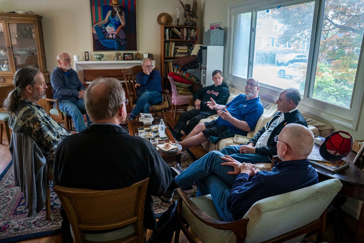 Michael Slott leads book club at his Silver Spring, Md., home. He chose the 1974 science fiction novel, “The Mote in God’s Eye,” by Larry Niven and Jerry Pournelle.  (Maxine Wallace/The Washington Post)