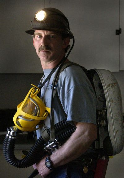 
David Gray is team captain of the mine rescue team at the Galena Mine near Silverton, Idaho. He is wearing the breathing apparatus used by mine rescue teams to get into mines that may be filled with smoke, carbon monoxide and other deadly gases. Gray's uncle died in the Sunshine Mine disaster in 1972. 
 (Photos by Jesse Tinsley / The Spokesman-Review)