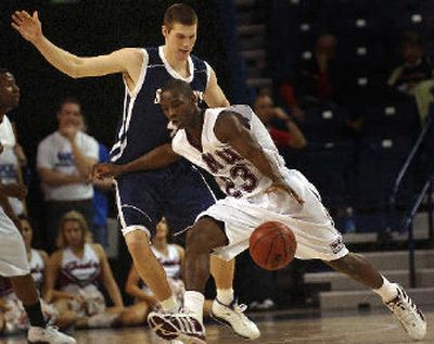 
LMU's Jon Ziri drives by Ian O'Leary.
 (Brian Plonka / The Spokesman-Review)
