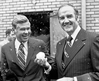 Democratic presidential nominee George McGovern, right, holds a snowball he made, in Billings,  while standing next to Montana Sen. John Melcher on Sept. 25, 1972. Melcher, a Montana Democrat who narrowly lost a bid for a third term in 1988 just days after a wilderness bill he championed was vetoed, has died. He was 93. (Bob Daugherty / Associated Press)