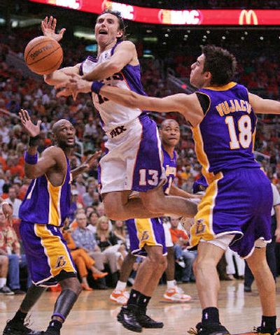 
Los Angeles' Sasha Vujacic, right, fouls Phoenix's Steve Nash, center, in the fourth quarter of Sunday's playoff game. 
 (Associated Press / The Spokesman-Review)