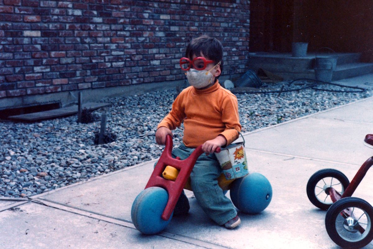 Boys will be boys: Nicholas Schuerman, 2, is allowed to play outside in Mead after the eruption but only when wearing a mask. “The kids were so desperate to play outside, so we relented,” wrote his mother, Jan Schuerman. Courtesy of Jan Schuerman (Courtesy of Jan Schuerman)