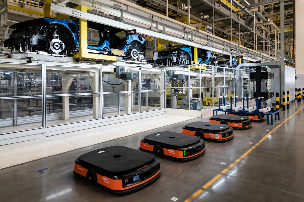 Robotic carts for hauling heavy loads around the assembly lines at the Zeekr auto plant on March 31 in Ningbo, China.  (New York Times)