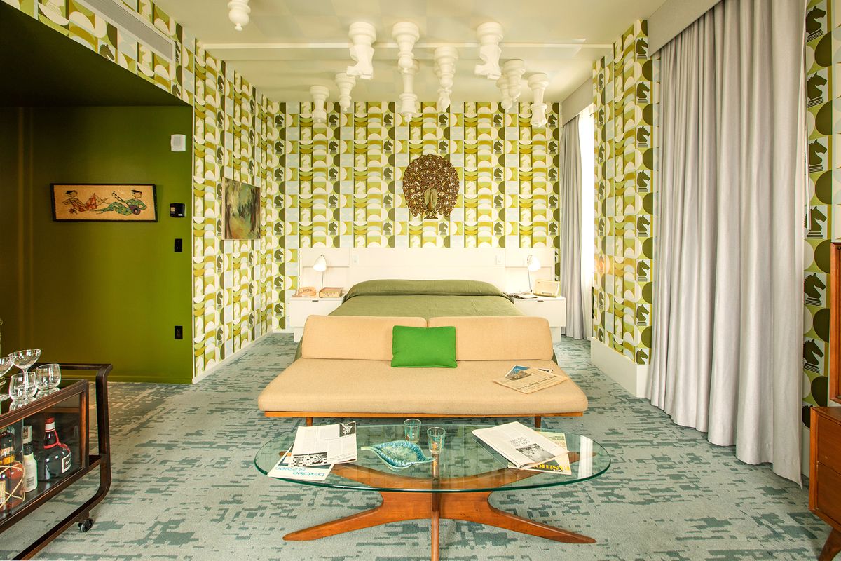 The Harmon Room at 21c Museum Hotel features cheese pieces on the ceiling and in the wallpaper.  (VisitLex)