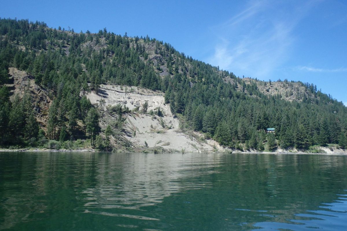 An April 2, 2017, a landslide, shown, on part of Porcupine Bay Road in northeastern Washington plunged downslope into Lake Roosevelt.  (Courtesy Lincoln County Public Works)