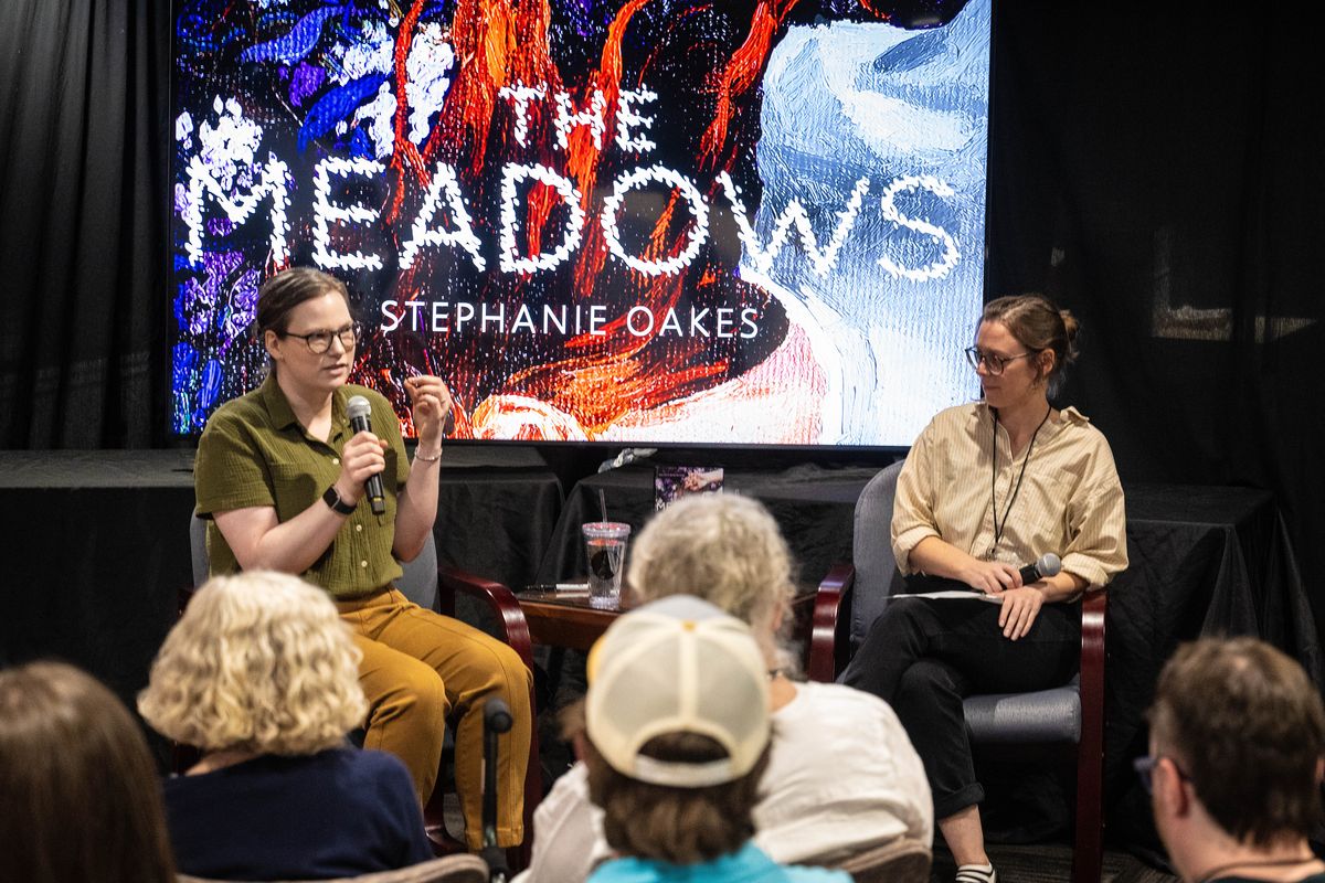 Young adult author Stephanie Oakes, on left, has a conversation with author Alexis Smith about Oakes eagerly anticipated young adult novel, "The Meadows” during a Northwest Passages book launch event held, Tuesday, Sept. 12, 2023, in the Chronicle Building. Oaks is also the author of “The Sacred Lies of Minnow Bly,” which was a Morris Award finalist and a Golden Kite Honor book, and “The Arsonist,” which won the Washington State Book Award and was an ALA/YALSA Best Fiction.  (COLIN MULVANY/THE SPOKESMAN-REVI)