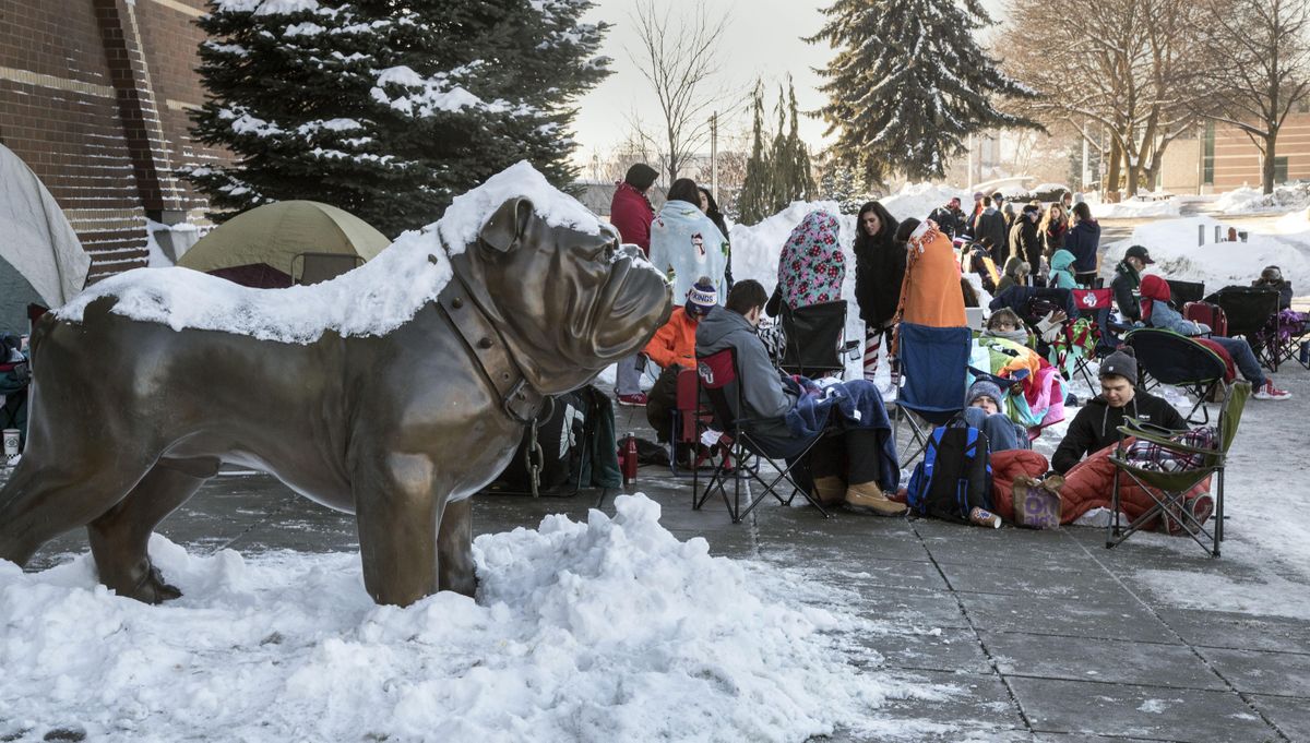 Gonzaga Kennel Club members wait in the cold and snow for entrance to the Zags-Saint Mary’s game, Jan 14, 2017. (Dan Pelle / The Spokesman-Review)