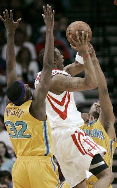 
Houston's Tracy McGrady, center, has stepped up for the Rockets in Yao Ming's absence. Associated Press
 (Associated Press / The Spokesman-Review)