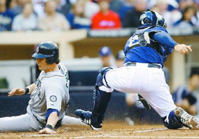 
Seattle's Richie Sexson slides home ahead of the tag of San Diego catcher Josh Bard in the second inning on Friday. 
 (Associated Press / The Spokesman-Review)