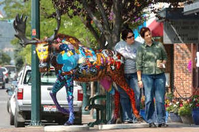 
Kim Bonner, left, and Kelly Kuhn, visiting from San Francisco, pose for a picture with Fillmore West, the fiberglass moose at Fourth and Sherman in Coeur d'Alene Wednesday afternoon. 
 (Jesse Tinsley / The Spokesman-Review)