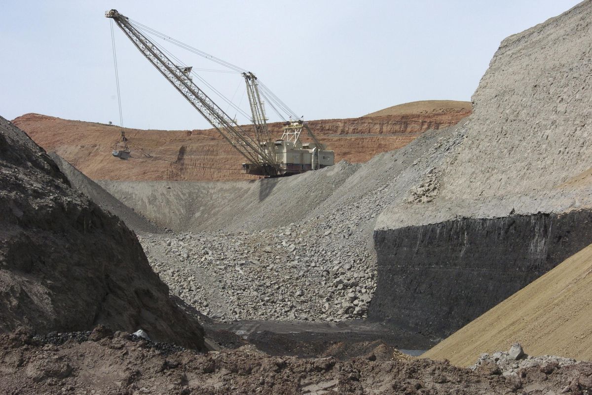 On April 4, 2013,  a dragline excavator moves rocks above a coal seam at the Spring Creek Mine in Decker, Mont. (Matthew Brown / Associated Press)