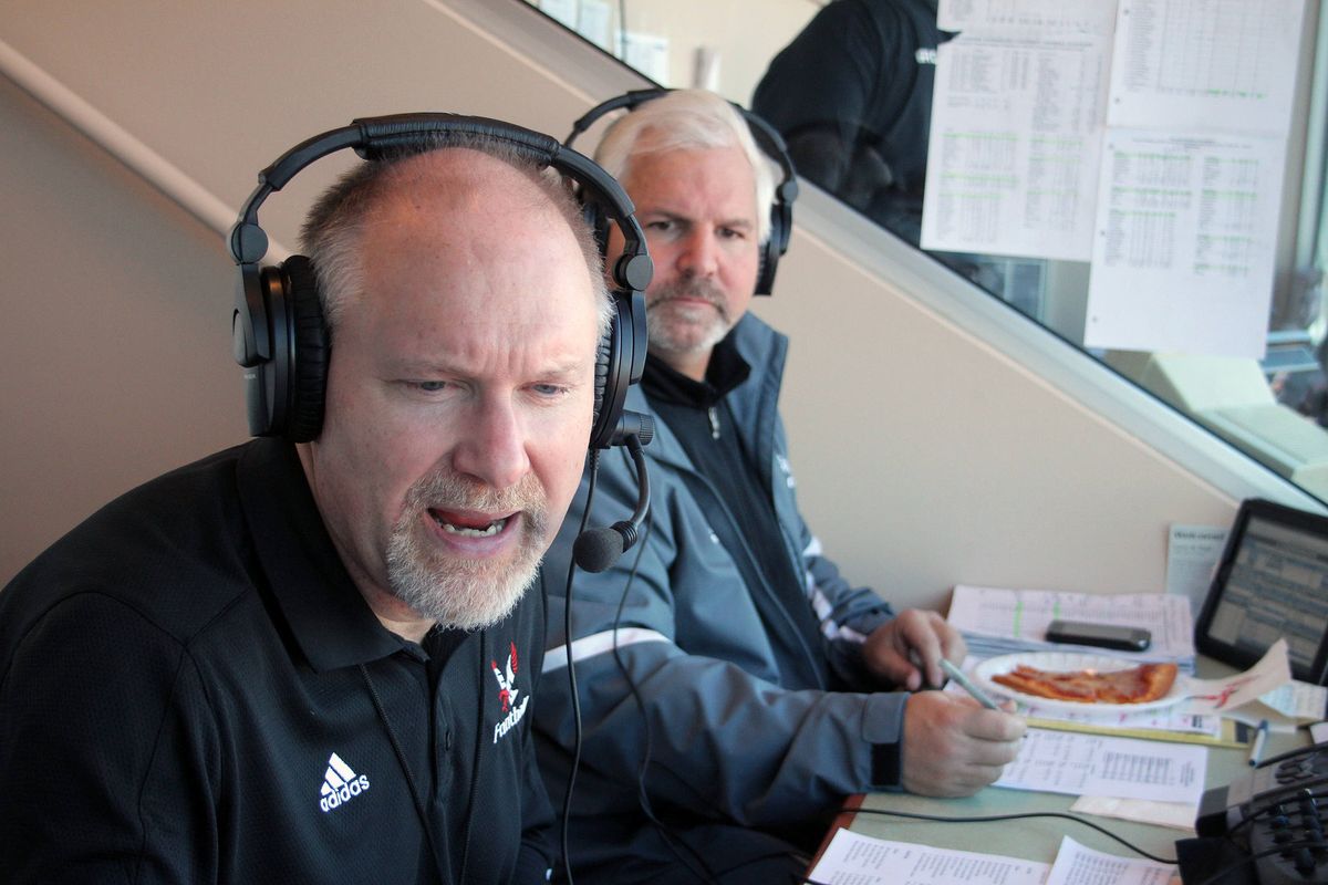 Larry Weir and Paul Sorensen, rear, call EWU football games.