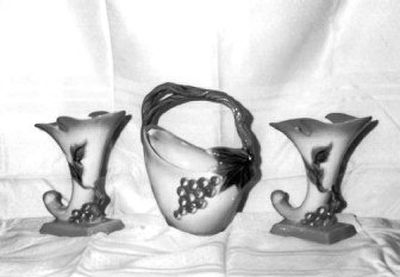 Group together things that you have collected to make them look more interesting, such as these expensive 1950s Tokay vases made by Hull Pottery. Or look at items you've brought back from trips. Take a cheap pottery vase, put it under a glass case and people will think it's a pre-Columbian artifact. Frame a quilt and hang it on the wall, and it looks like art.
(AP / The Spokesman-Review)