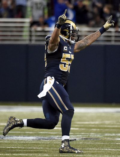 Rams linebacker James Laurinaitis celebrates St. Louis’ overtime victory over Seattle. (Associated Press)