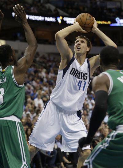 Mavericks forward Dirk Nowitzki finished with 27 points on 9-of-14 shooting and made all four of his 3-point attempts in Dallas win. (Associated Press)