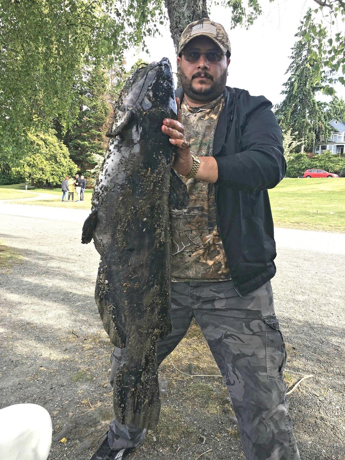 Ahmed Majeed shows off his catch of a huge catfish on Saturday, June 9 at Green Lake. (Courtesy of / Ahmed Majeed)