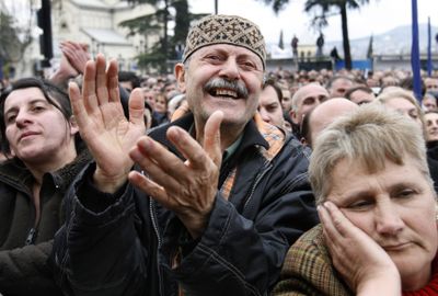 Protesters attend a rally in front of the parliament building in Tbilisi, Georgia, on Thursday, calling on the president to quit.  (Associated Press / The Spokesman-Review)