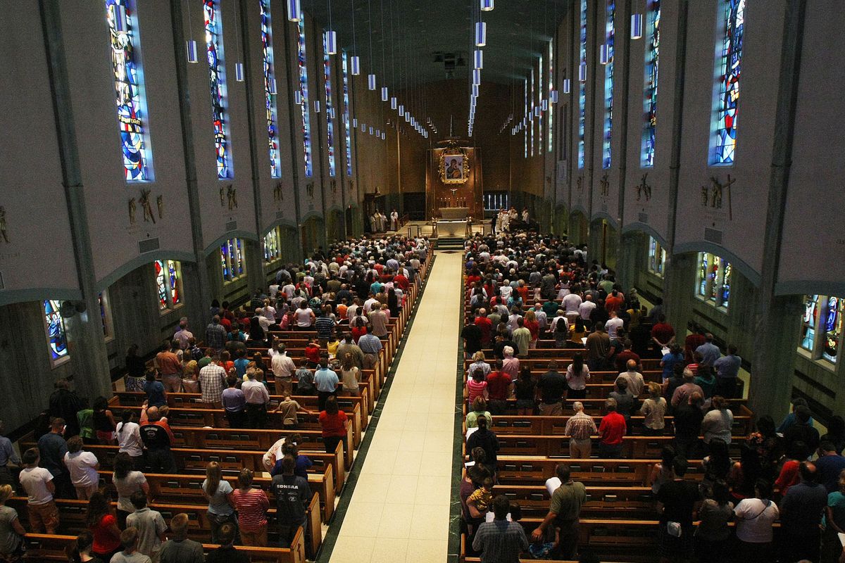 Parishioners attend Bishop Cupich’s farewell Mass at the Cathedral of Our Lady of Perpetual Help in Rapid City, S.D., on  Aug.15. 