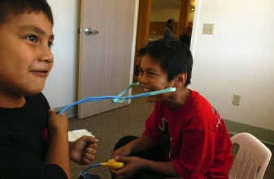 
Cheldon Ramos-Herman, 9, right, and his brother Quannah, 7, play doctor and patient in the children's waiting room area at the new San Poil Valley Community Health Center on the Colville Reservation on Friday after the center's grand opening. 
 (Jed Conklin / The Spokesman-Review)