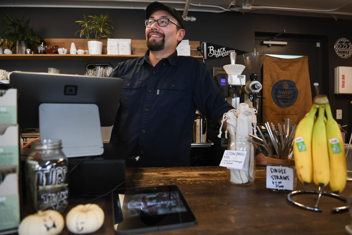 Bobby Enslow, owner of Indaba Coffee, is one of many small business owners that use Square to process credit cards. Square is raising its transaction fees Nov. 1, which could cost small businesses hundreds of dollars a month. (Tyler Tjomsland / The Spokesman-Review)