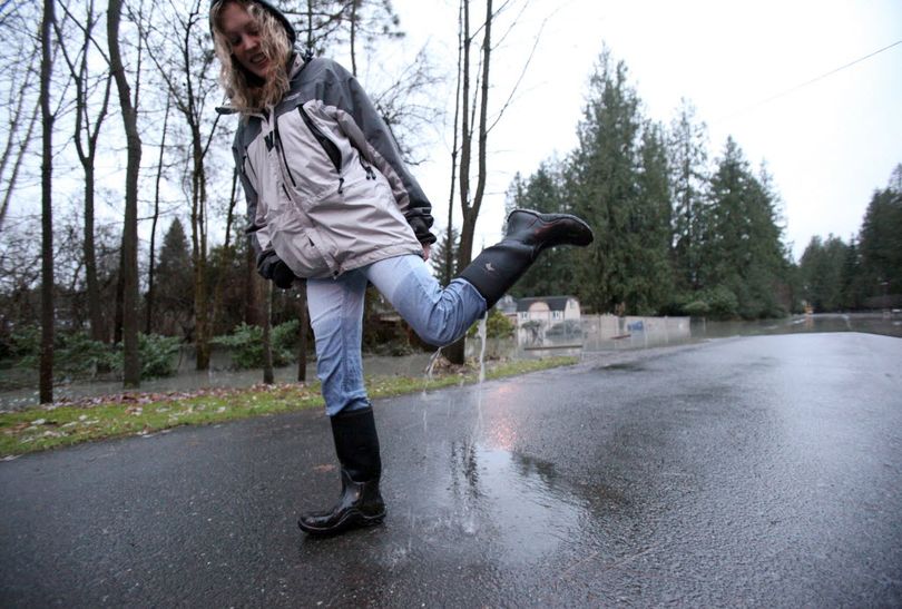 Rain and melting mountain snow are prompting flood warnings. (Associated Press)