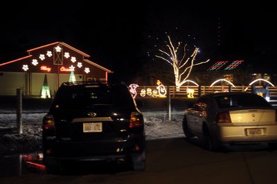 A steady stream of cars stop and park at 3107 S. Glenrose Road in Spokane on Monday. The display is animated and has music played with the movement of the lights.  (CHRISTOPHER ANDERSON / The Spokesman-Review)