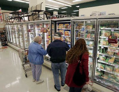 
Shoppers look through the frozen foods section at the Acme supermarket store in Lawrenceville, N.J. Americans can be forgiven for being leery of Chinese-made goods and trying to fill their grocery carts with foods free of ingredients from that country. The trouble is, that may be almost impossible. Associated Press
 (Associated Press / The Spokesman-Review)