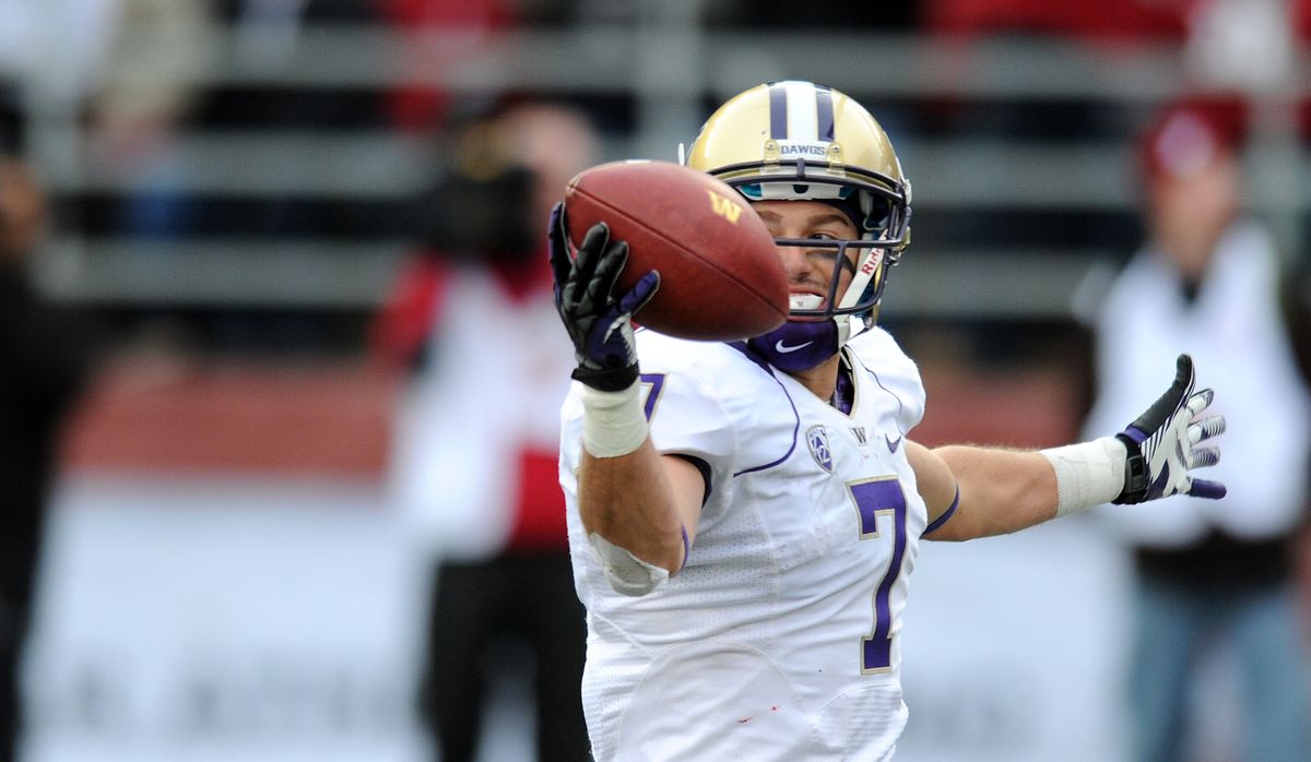 Cody Bruns hauls in a second-half touchdown pass for the Huskies during a 31-28 overtime loss to Washington State in this year’s Apple Cup. (Tyler Tjomsland)