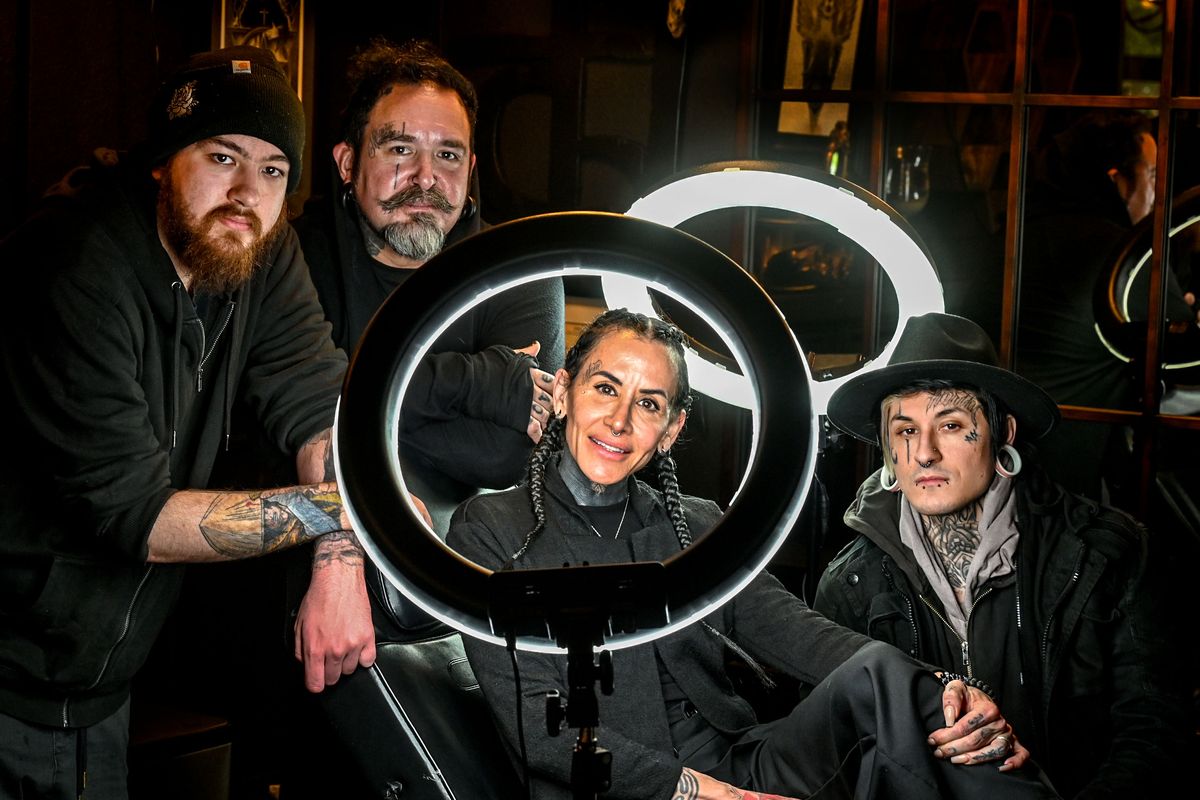 The Koskela family of Dayin, left, Peter, Eelisha and Kevin gather in their Moon and Mercury Tattoo business at 2718 E. 57th Ave. on March 27 in Spokane.  (DAN PELLE/THE SPOKESMAN-REVIEW)