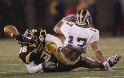 
Titus Howard, left, breaks up pass intended for Delaware's Aaron Love.Associated Press
 (Associated Press / The Spokesman-Review)