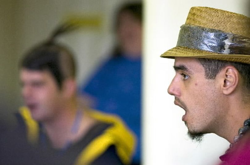 Peter  Jose ( right ) concentrates on hitting the right note as he works with On Stage to rehearse their upcoming Christmas show Thursday October 26, 2006 in Spokane.  (Christopher Anderson / The Spokesman-Review)