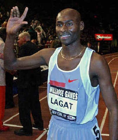 Bernard Lagat takes a victory lap after winning the Wannamaker Mile at the Millrose Games in February.
(File/Associated Press / The Spokesman-Review)