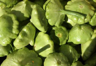 
These Patty Pans, a type of summer squash, are about the size of an adult palm. 
 (File / The Spokesman-Review)