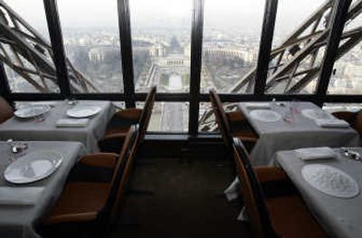 
A table at the Jules Verne restaurant in the Eiffel Tower offers a commanding view of Paris. Chef Alain Ducasse, below, will take over the kitchens of the restaurant today.Associated Press photos
 (Associated Press photos / The Spokesman-Review)