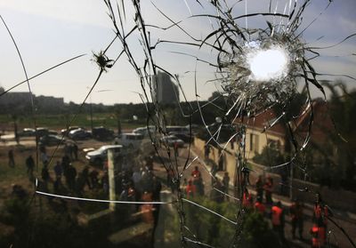 A shattered window is seen after a rocket fired by Palestinian militants in Gaza hit the southern Israeli city of Ashkelon on Monday. Israel seized control of high-rise buildings and attacked houses, mosques and tunnels as it pressed forward with its offensive against the Gaza Strip’s Hamas rulers.  (Associated Press / The Spokesman-Review)