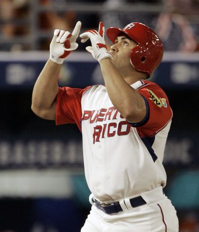 Puerto Rico’s Carlos Beltran gestures after hitting a solo homer against the U.S. team.  (Associated Press / The Spokesman-Review)