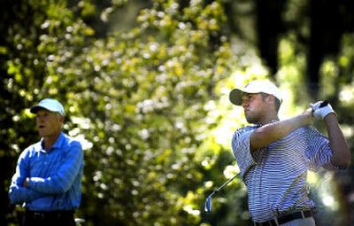
Alex Prugh of Spokane watches his tee shot on the seventh hole during Friday's first round. Prugh shot a 67 and is tied for low amateur. He is seventh overall. 
 (Jed Conklin / The Spokesman-Review)