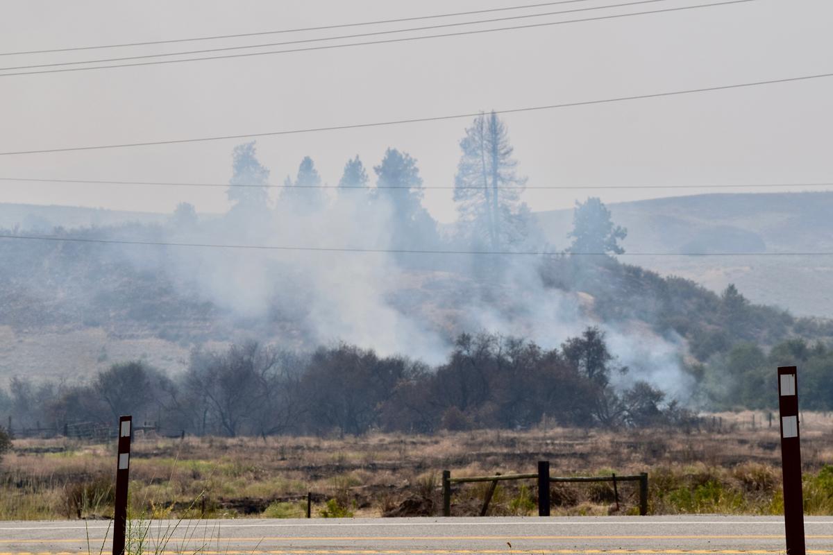 Smoke billows from an area of Nespelem, Wash., on Tuesday, July 21, after a raging wildfire destroyed 68,000 acres of land.  (Alexandra Duggan / The Spokesman-Review)