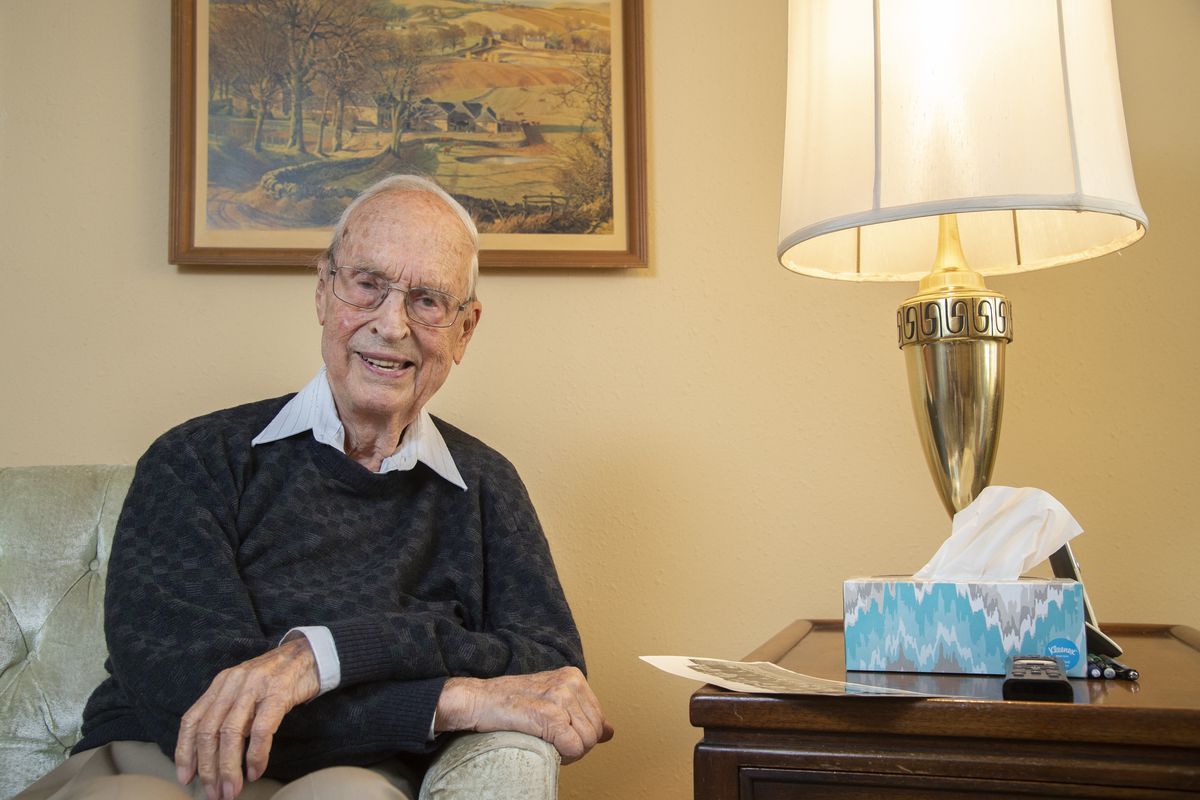 Larry Morse, who turned 100 recently, sits for a photo on Sept. 14 in his apartment at Rockwood Retirement Center in Spokane. Morse served in World War II, following the D-Day invasion into France working as a replacement officer for units already on the European continent, then married and became an accountant with his own firm.  (Jesse Tinsley/The Spokesman-Review)