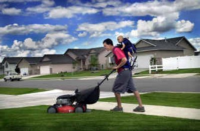 
An unkempt lawn is a signal that homeowners may be away. Before leaving for vacation, remember to leave your home with that lived-in look by mowing the lawn and trimming the bushes. If possible, hire a lawn service – or a neighbor – to care for your yard while away.
 (File photo / The Spokesman-Review)