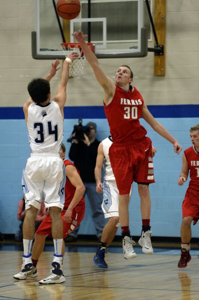 Ferris’ Cody Benzel blocks a shot by Central Valley’s Justin Fayant during Tuesday’s loss to the Bears. (Colin Mulvany)