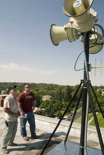 
WSU construction coordinators Clyde Willhelm, left, and  Matt Allen look over one of five new loudspeaker stations Thursday.
 (Brian Immel / The Spokesman-Review)