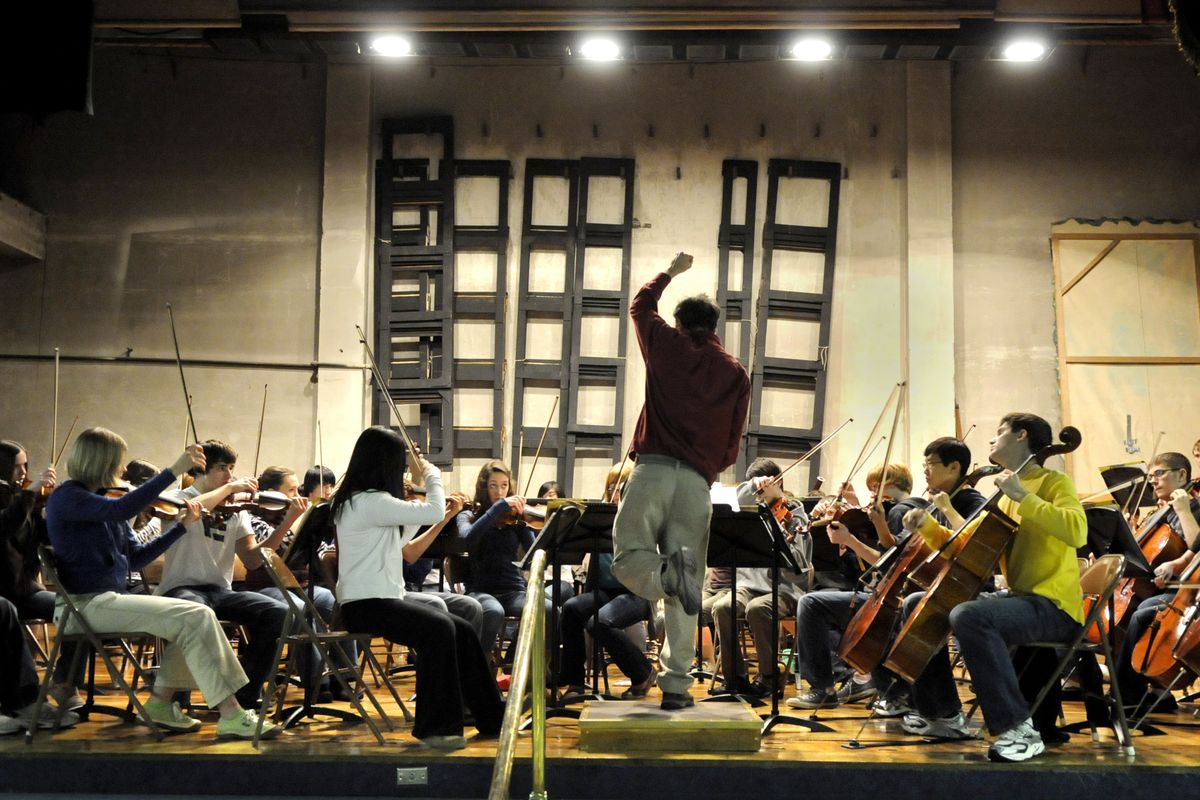 Verne Windham conducts a rehearsal of the Spokane Youth Orchestra last month at the Masonic Center. (Dan Pelle)