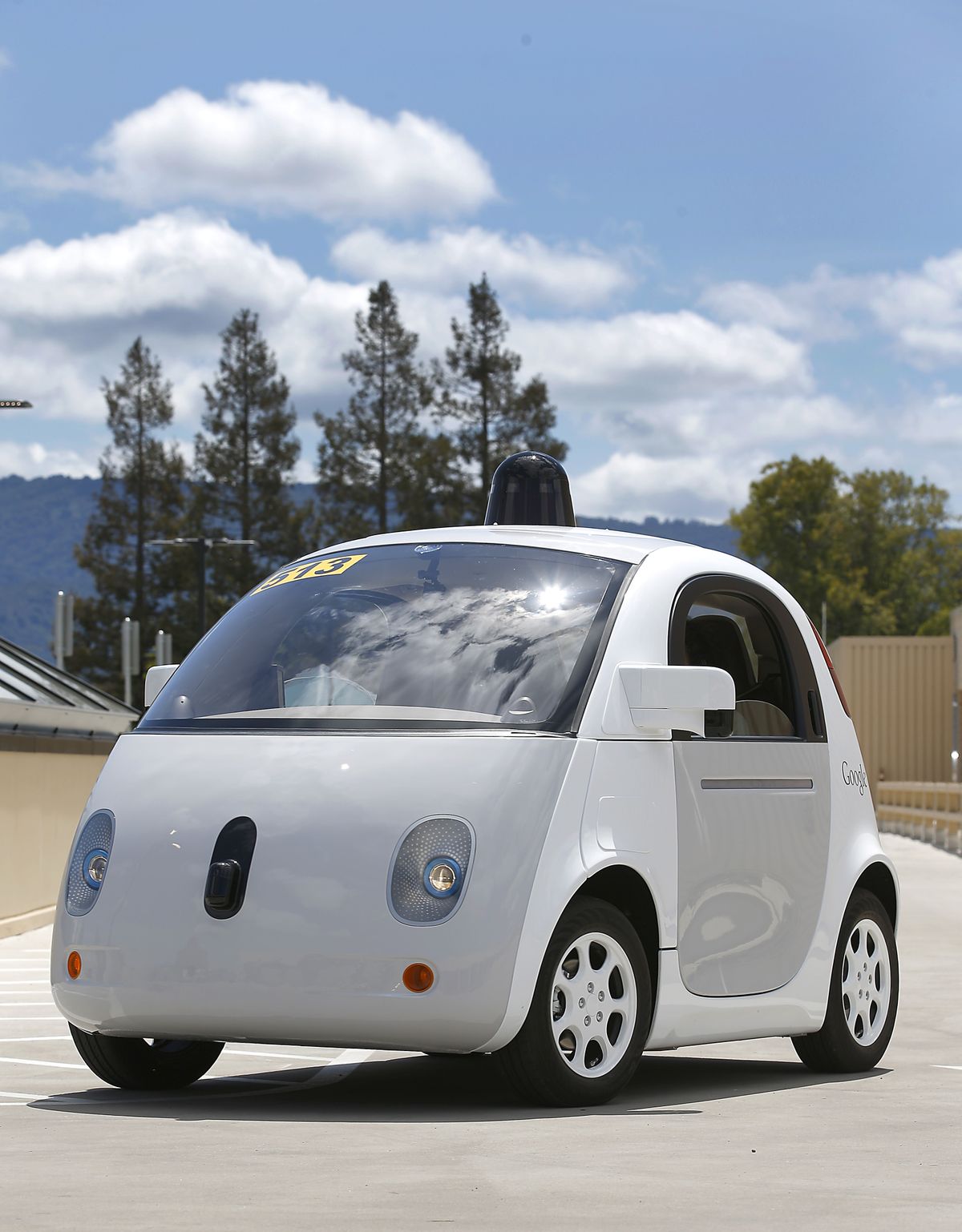 Google’s self-driving prototype car drives around a parking lot at the Google campus in Mountain View, Calif., on May 13. Google has hired former Hyundai and Ford Motor Co. executive John Krafcik to head its self-driving car division. (Associated Press)