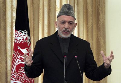 Afghan President Hamid Karzai gestures during a press conference at the presidential palace in Kabul  on Saturday.  (Associated Press / The Spokesman-Review)