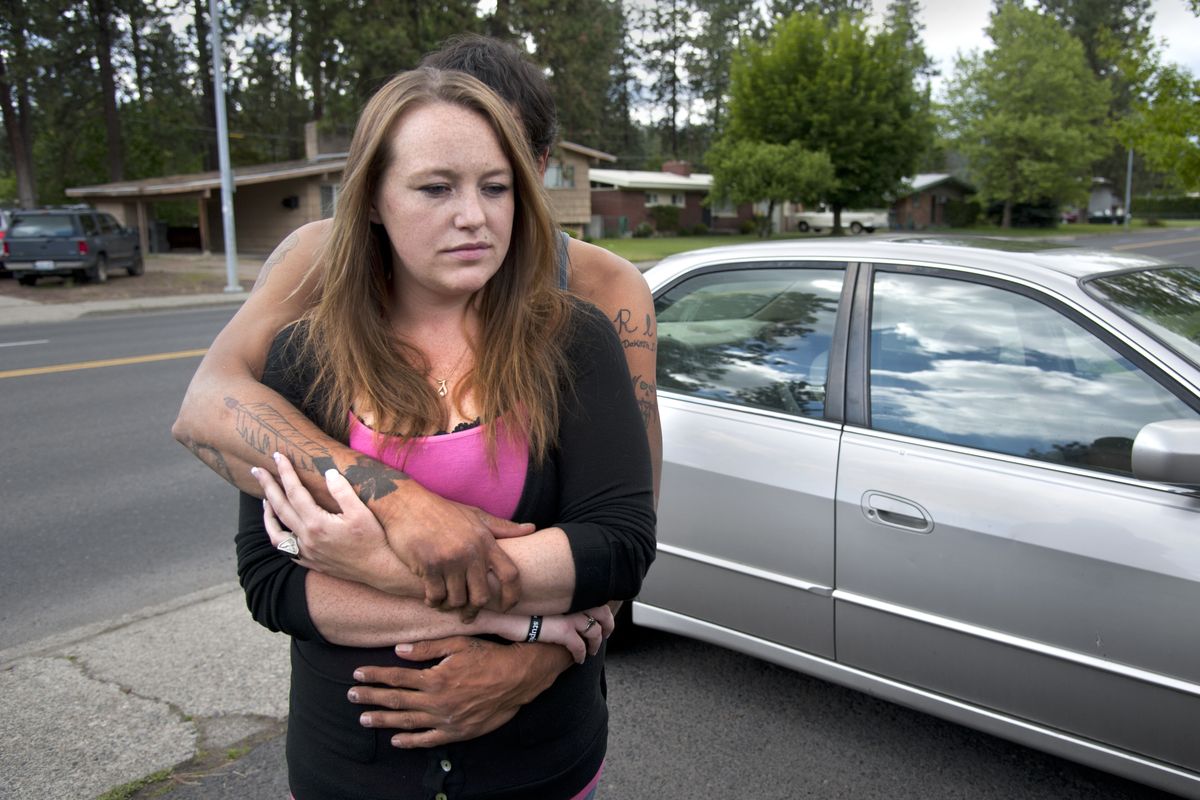Amber Donges is consoled by her fiance, Travis Ashby, on Monday as they reflect on Donges’ uncle Roy Jacobs. Spokane County sheriff’s deputies shot and killed Jacobs on Saturday after he threatened officers with a knife and refused to drop it, investigators say. (Dan Pelle)