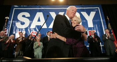 Sen. Saxby Chambliss, R-Ga., hugs his wife, Julianne, during an election-night party Tuesday in Atlanta.  (Associated Press / The Spokesman-Review)
