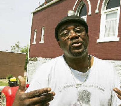
The Rev. William A. Hill talks about gasoline prices while taking a break from cutting the grass at his Baptist Church in Pittsburgh on Tuesday. 
 (Associated Press / The Spokesman-Review)