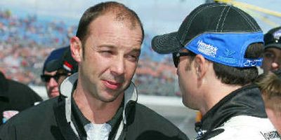 Jimmie Johnson, right, talks with Chad Knaus, who was caught for illegal modifications.
(Associated Press / The Spokesman-Review)